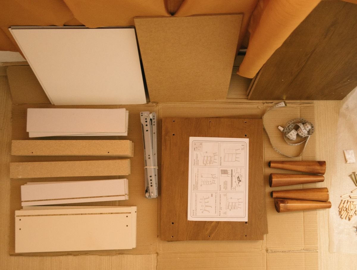 Furniture components and assembly instructions arranged together