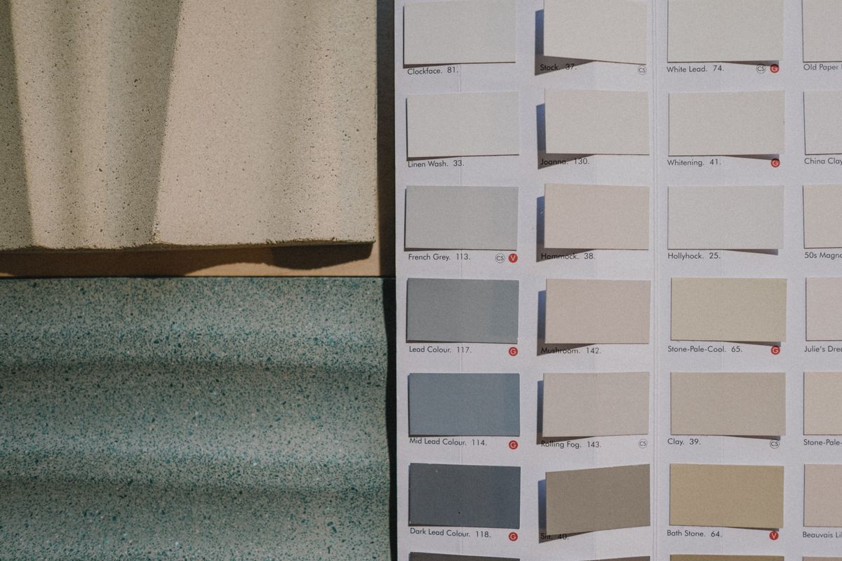 Paint colour samples beside textured materials