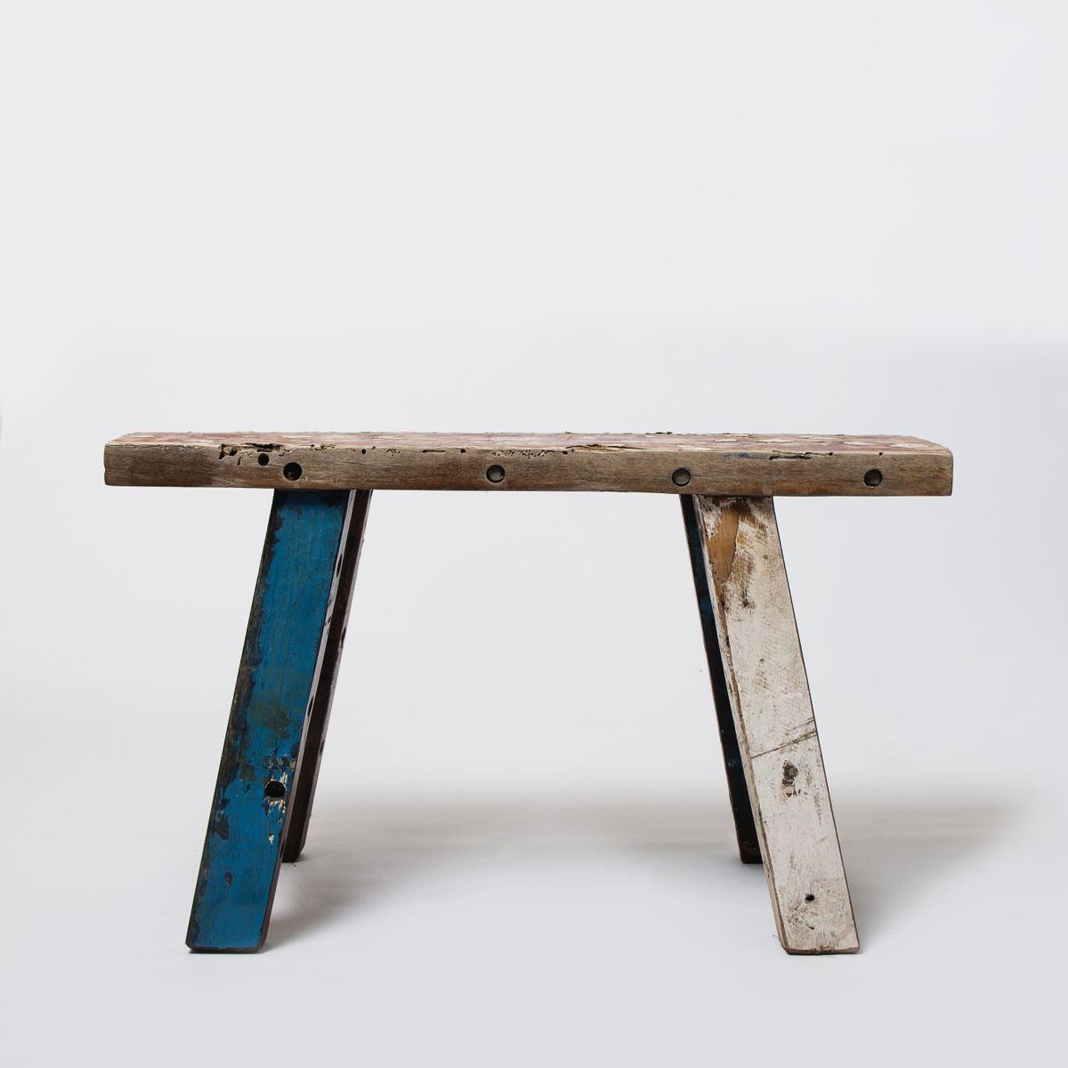 Wooden stool with painted legs