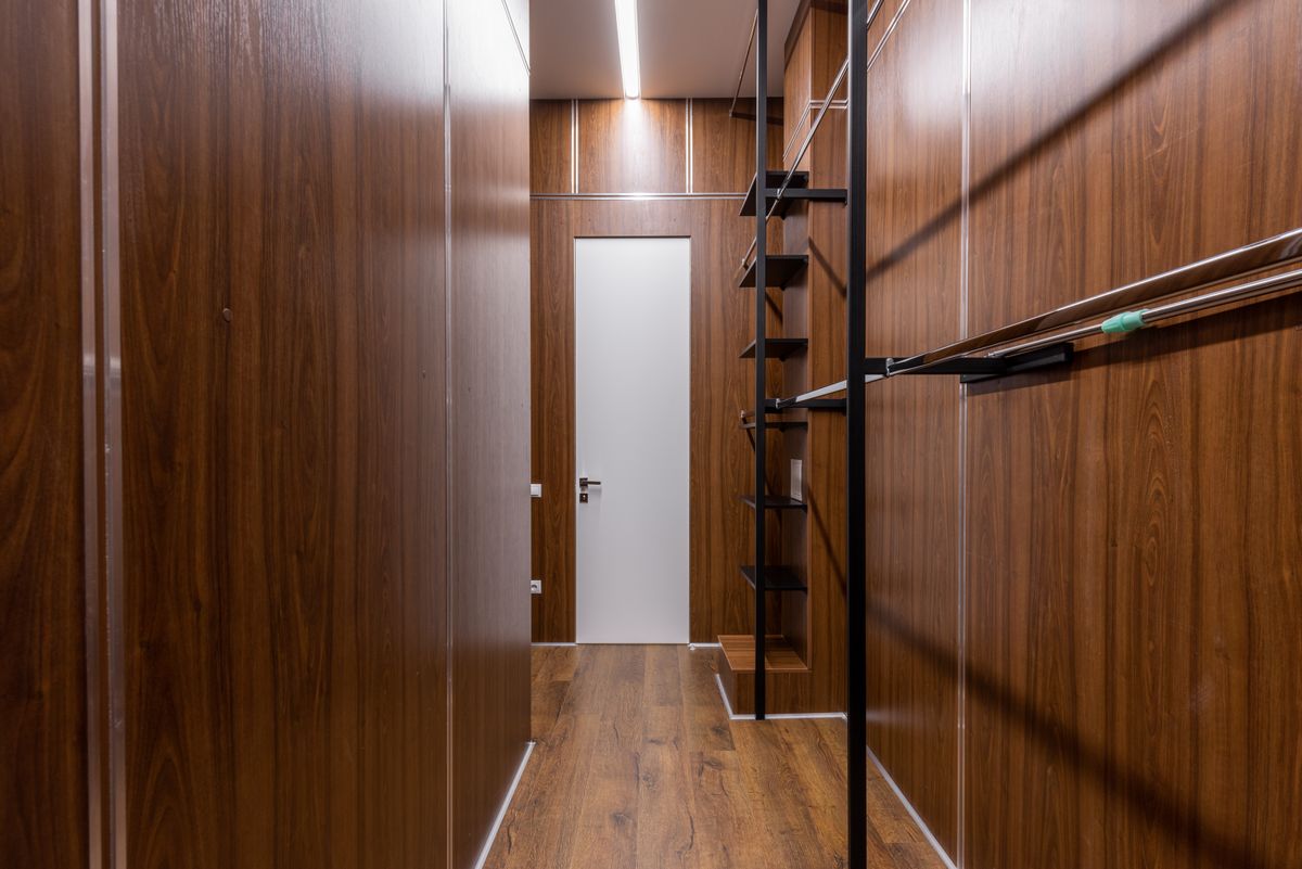 Hallway with shelves beside a clear walking route