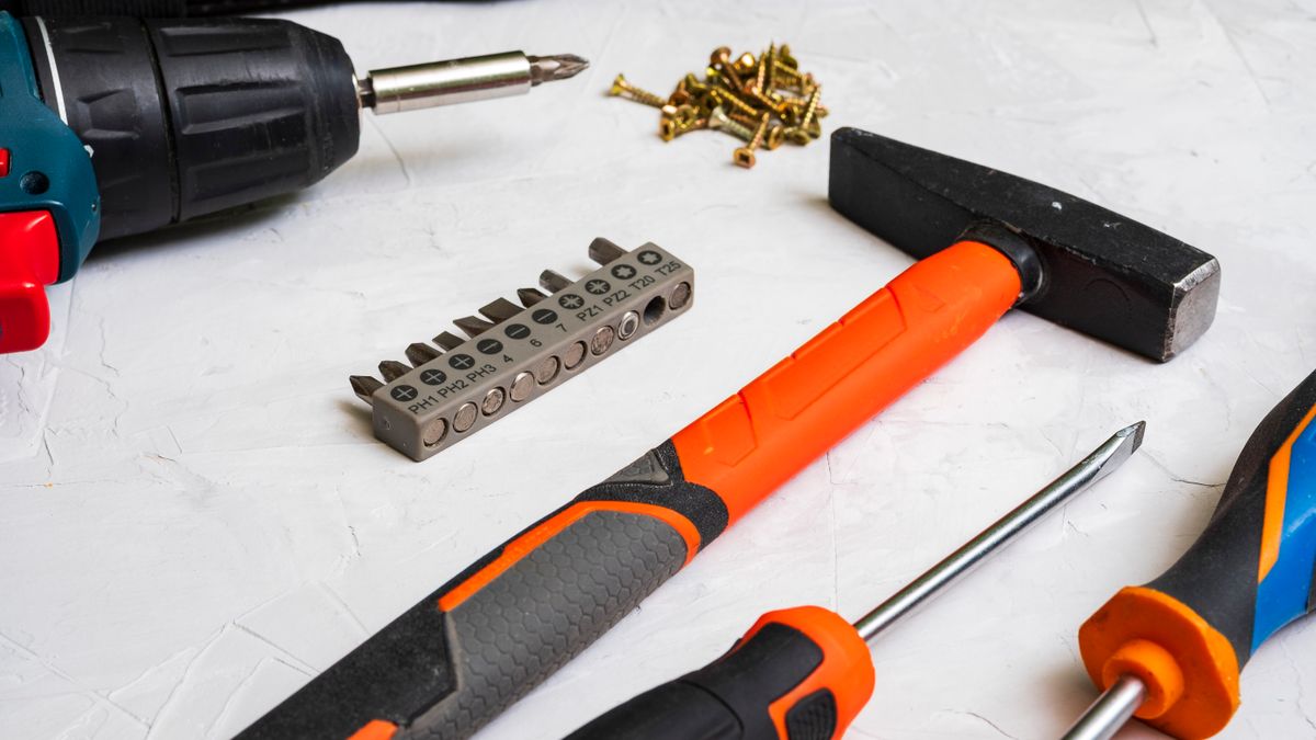 A selection of hand tools arranged for household projects