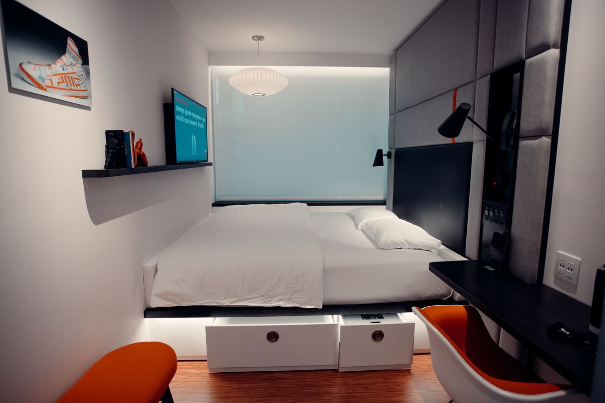 Bed with storage drawers built into its base