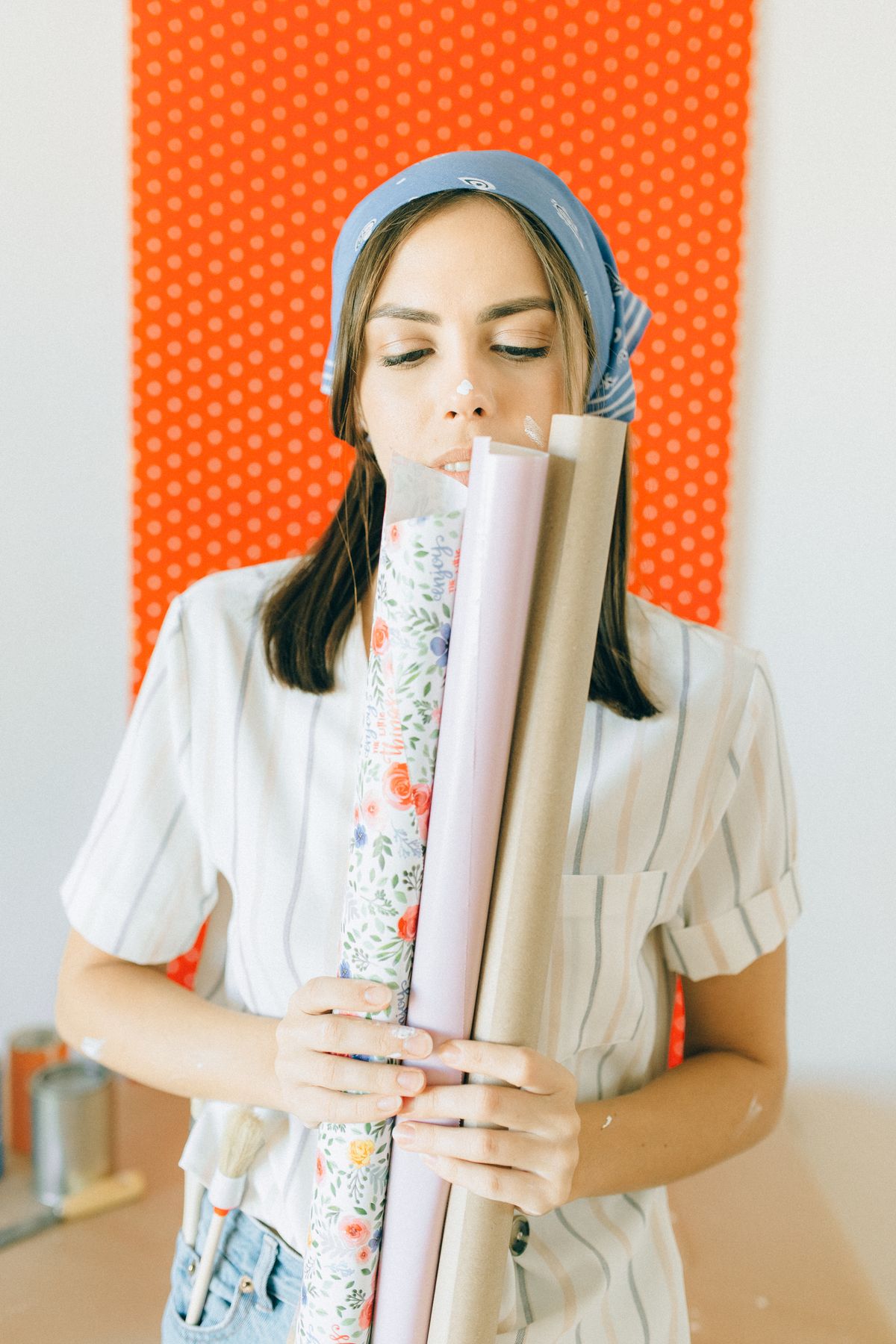 Wallpaper rolls being compared before decorating